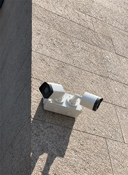 Outdoor IP CCTV cameras on a stone wall